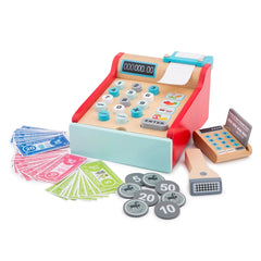 Red wooden toy cash register with blue and white buttons, paper money, and metal coins featuring numbers and symbols.