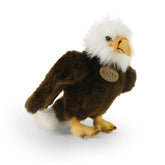 Plush eagle toy with a dark brown body, white head, yellow beak, and orange feet, featuring a "RAPPA" label on its chest.