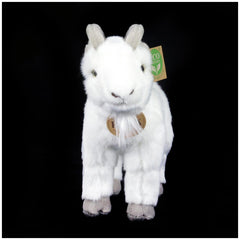 Plush goat toy with fluffy white fur, black eyes, and eco-friendly tag featuring a green leaf symbol, set against a black bac