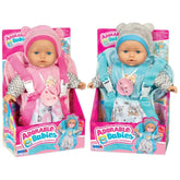 Adorable Babies dolls in pink and blue outfits, packaged in pink and white boxes, featuring large heads and cute accessories.