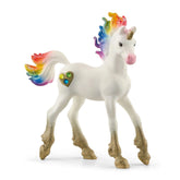Rainbow Love Unicorn Foal figurine features a glossy white body with a vibrant rainbow mane and tail, set against a white bac