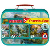 Colorful dinosaur-themed lunch box with a glossy teal finish, featuring puzzle pieces and bold branding.