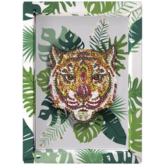 Decorative wall art featuring a vibrant, intricately detailed tiger's head embellished with beads against a green leaf backgr