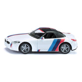 Siku BMW Z4 M40i model car in white with red and blue stripes, featuring a convertible top and silver multi-spoke wheels.