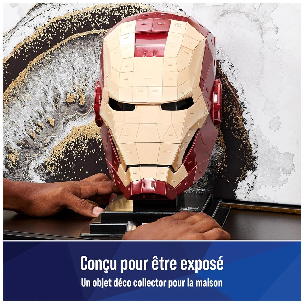 4D Build Marvel Iron Man 3D Puzzle Model Kit with a person wearing an Iron Man mask working on a project at a table.