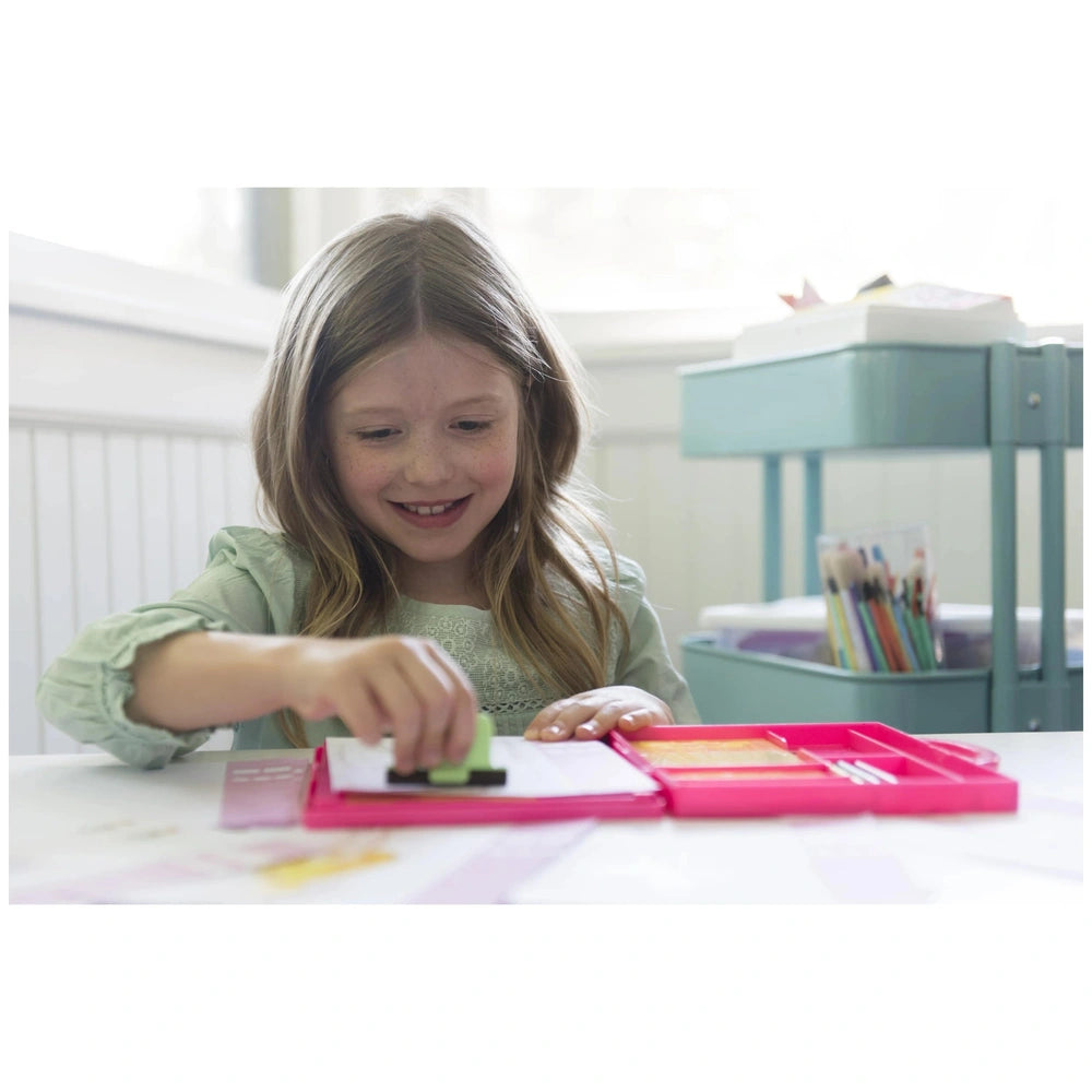 KidzMaker My Design Portfolio Fashion Studio featuring a girl with long blonde hair, light green shirt, and light blue pencil