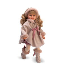 Doll in a pink cape, plush boots, and headband, with blonde curly hair and a delicate face.