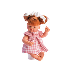 Red-haired doll in pink plaid dress with a chiffon collar and pigtails, on a white background.