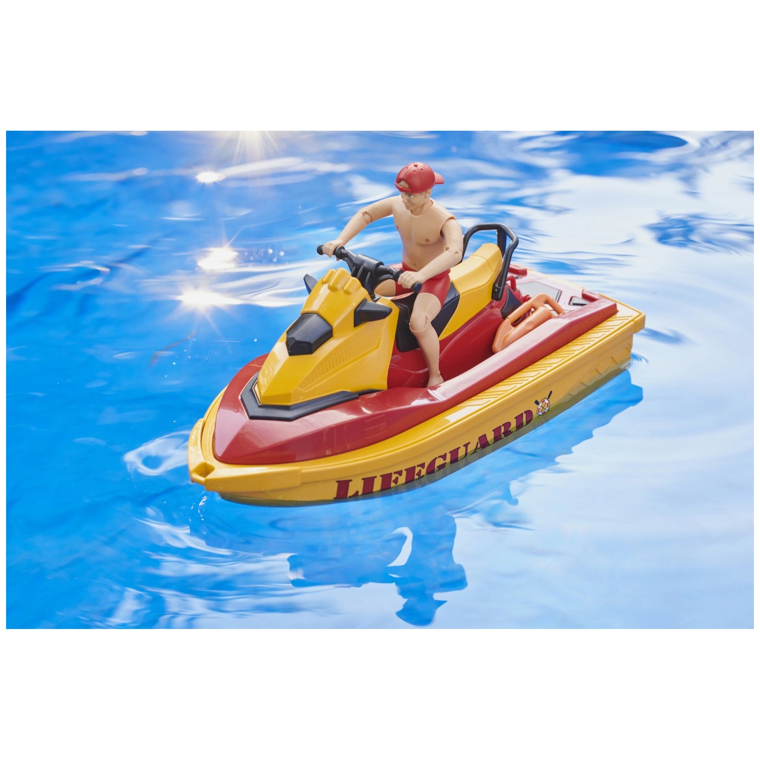Lifeguard figure on yellow and red personal watercraft in blue water, part of Bruder bworld playset.