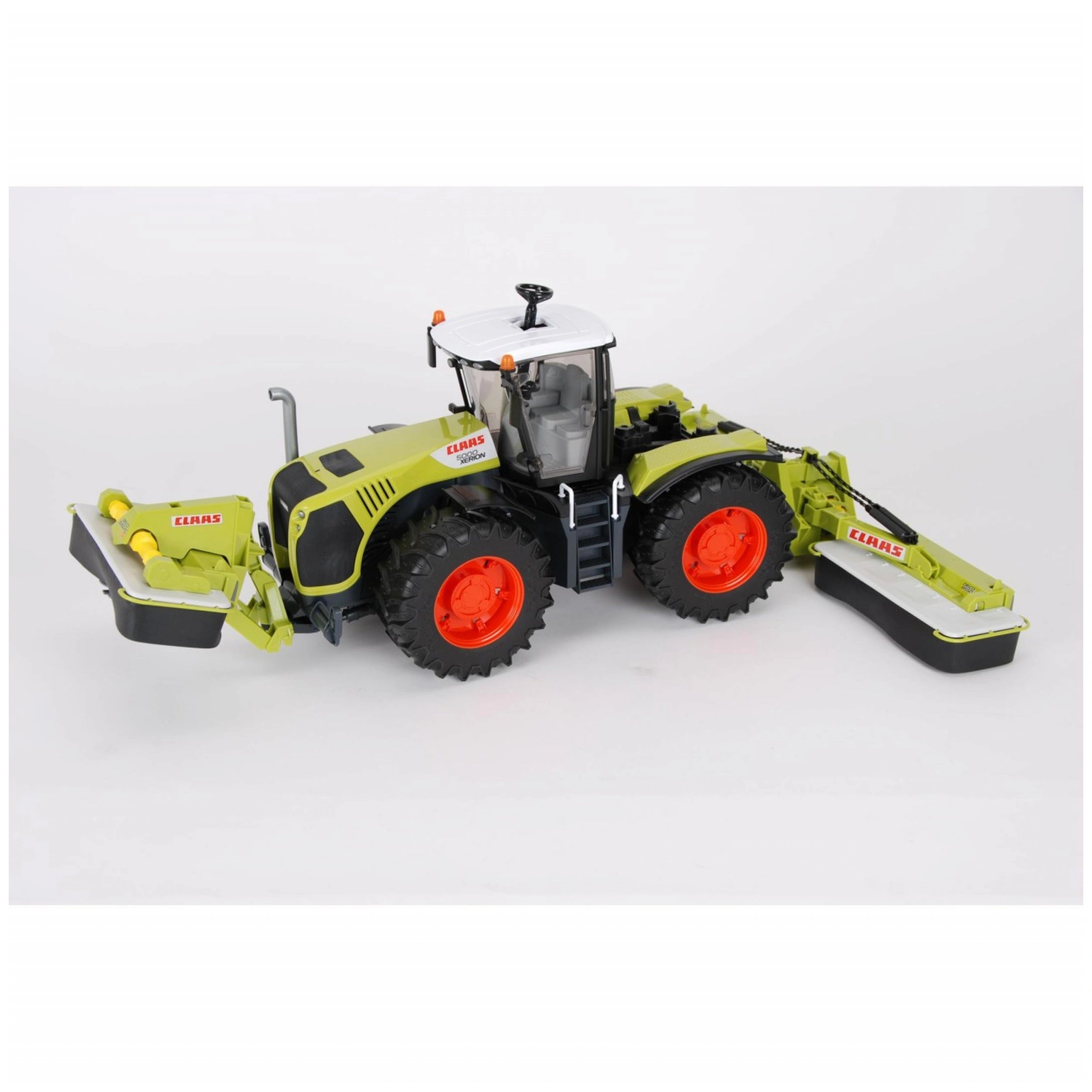 Green and black Claas Xerion 5000 toy tractor with rotating cab and bright orange wheels.