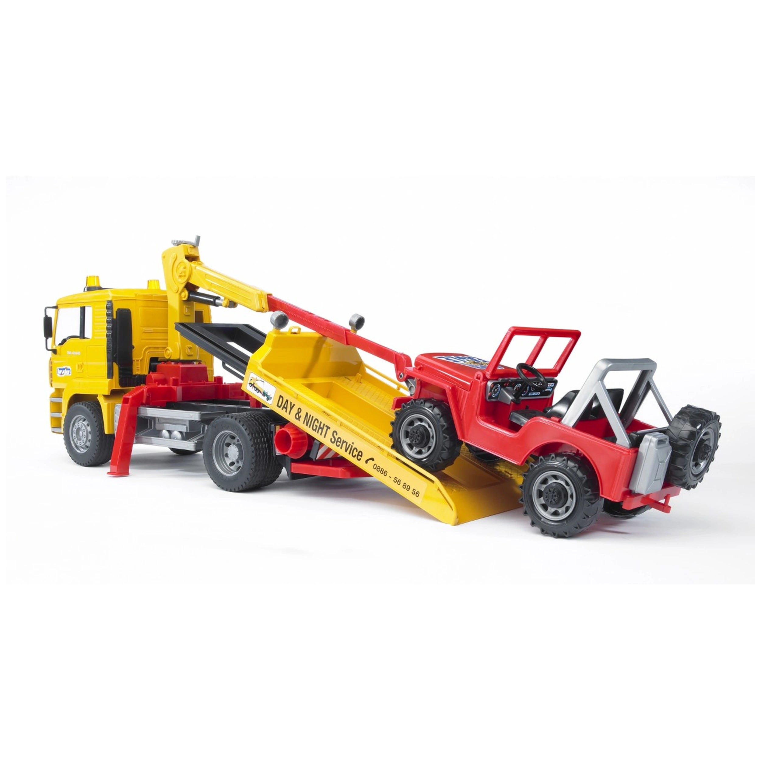 Yellow breakdown truck with red cross-country vehicle on its loading platform, branded "Day & Night Service".
