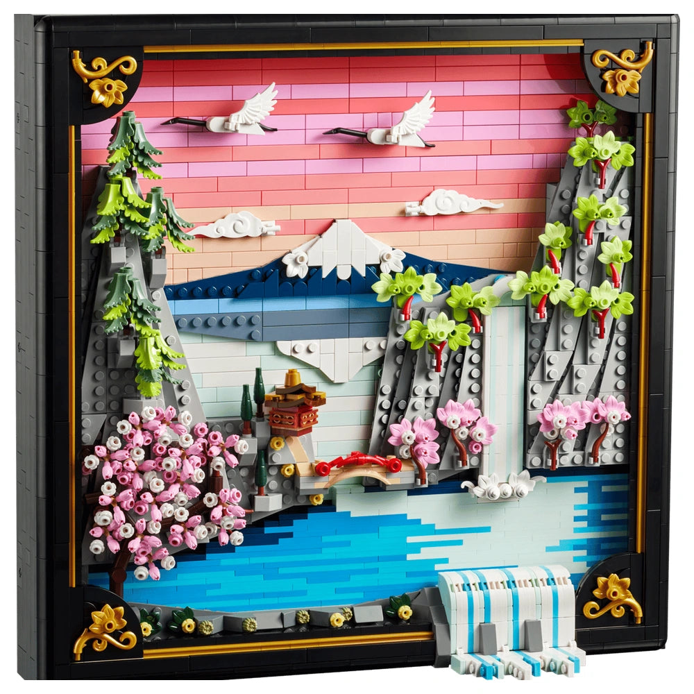 LEGO model of a Japanese cherry blossom landscape featuring water, a mountain, trees, and a small red-roofed building.