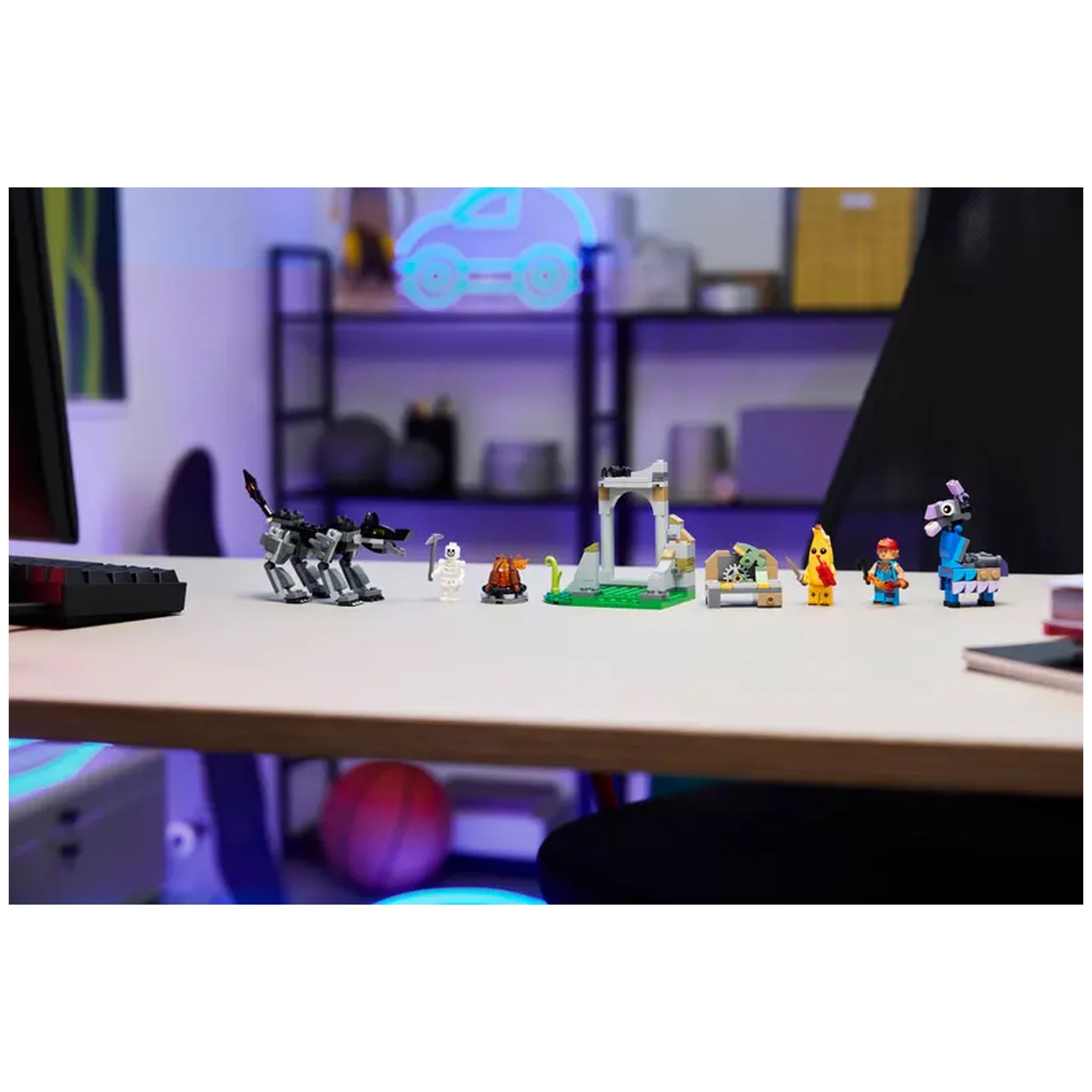 LEGO Fortnite Peely & Sparkplug's Camp set displayed on a table, featuring characters, a campfire, and a wolf figure against a colorful background.