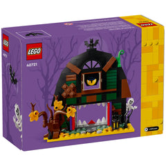 LEGO Halloween Barn (40721) box featuring a spooky barn with an open mouth, colorful details, skeleton, and bats, set against a purple backdrop.