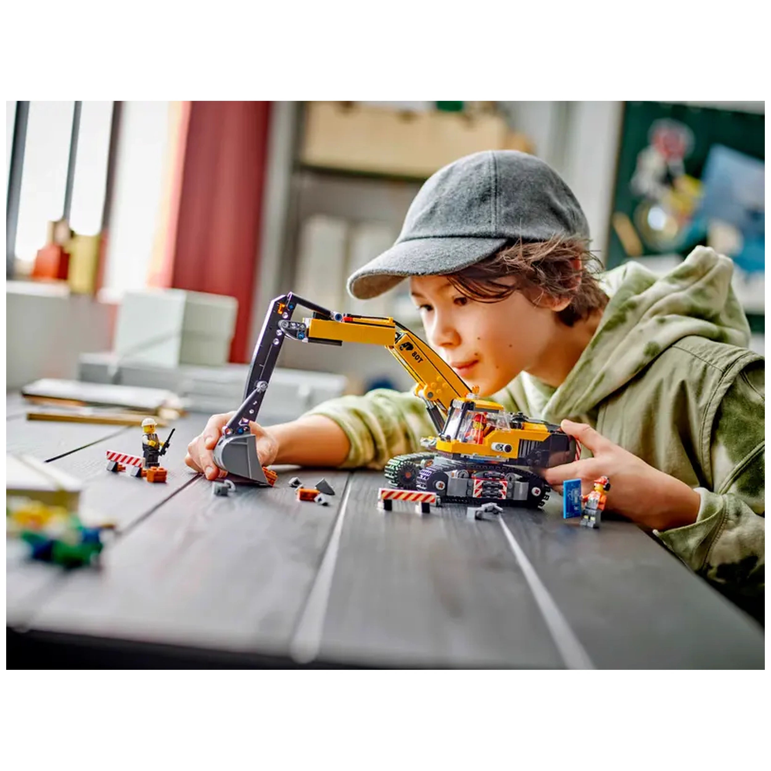 A young child focuses intently on a LEGO® City Yellow Construction Excavator set, manipulating its articulated arm. The scene includes construction accessories, two minifigures, and a textured wooden table.
