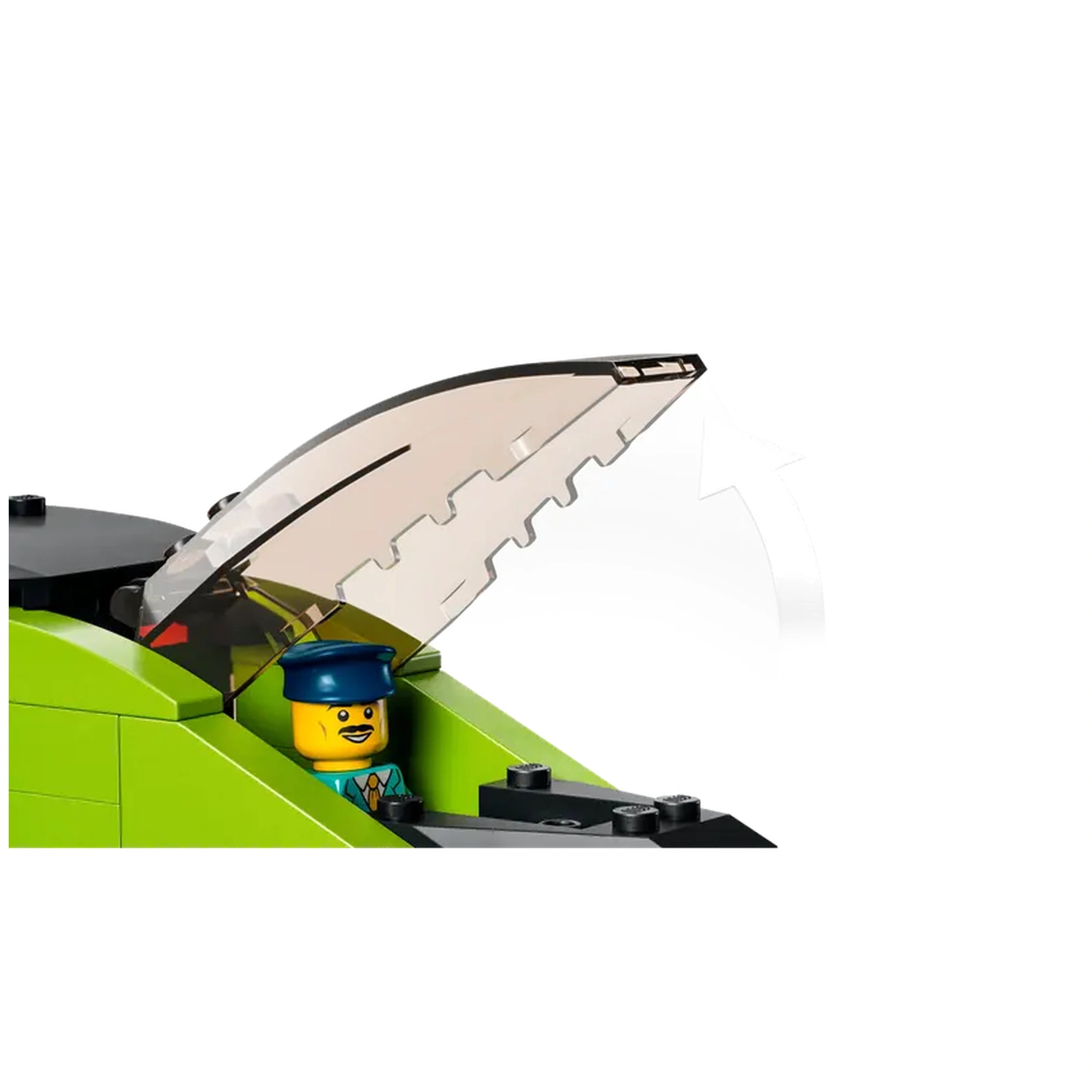 A green LEGO train locomotive with an open transparent hatch reveals a smiling conductor minifigure wearing a blue hat.