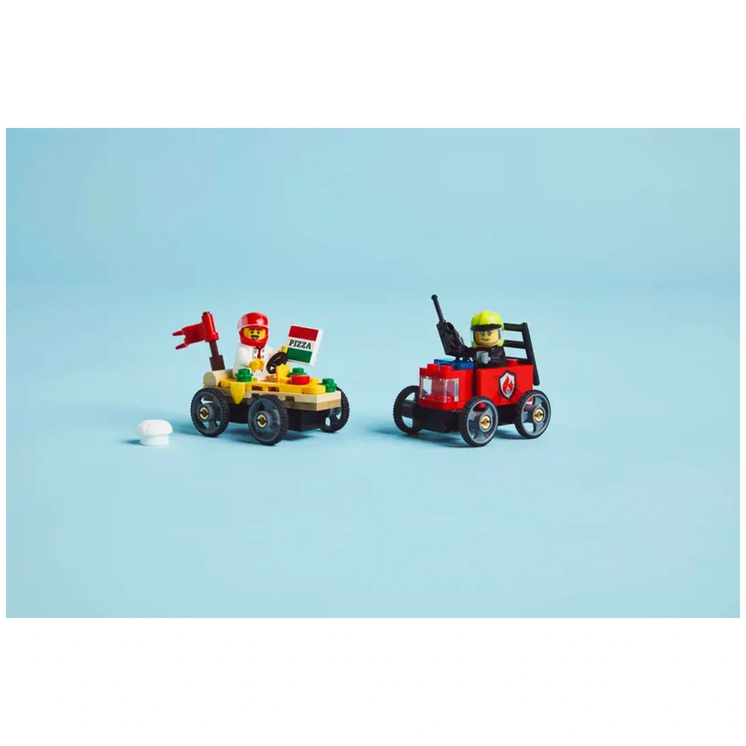 A colorful LEGO® set featuring two soapbox race cars: one shaped like a pizza slice with a chef and a red fire truck with a firefighter, both on a light blue background.