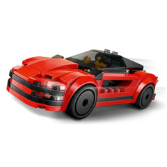 Red LEGO® City Sports Car construction set featuring a sleek design, black rims, and a driver minifigure in the cockpit.