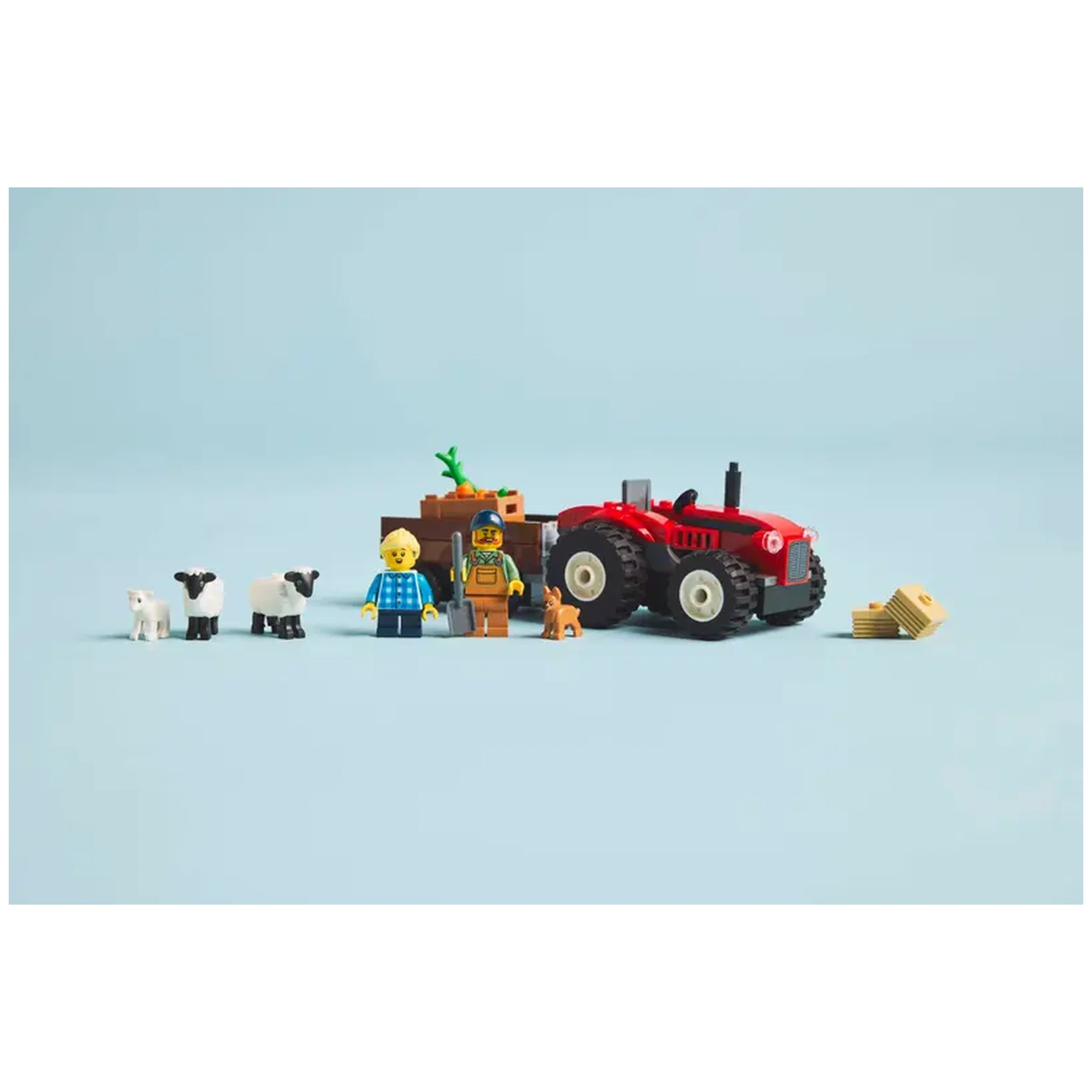 LEGO City Red Farm Tractor with detachable trailer, two minifigures, sheep, a lamb, and a puppy on a light blue background.