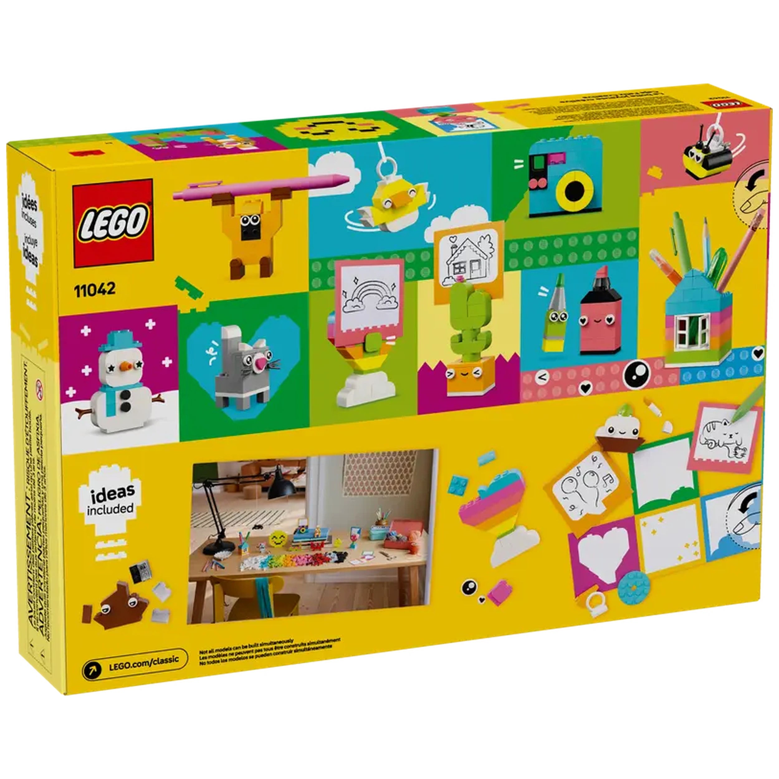 Colorful LEGO Classic Creative Happy Box packaging displaying various playful models like a snowman, a cat, and a green robot, with design ideas above. The background is vibrant yellow, featuring images of creative builds and art supplies. A small photo shows a creative workspace with a table, highlighting the imaginative projects.