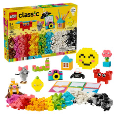 Colorful LEGO Classic Creative Happy Box set with 680 pieces, featuring vibrant bricks and playful models like a smiling emoji and a camera, arranged on a white background.