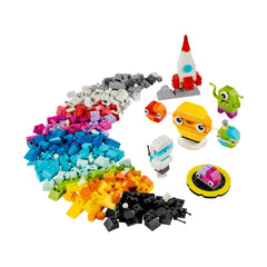 Colorful LEGO blocks scattered in various shapes, including a white rocket, an astronaut, and whimsical aliens, inviting creative space-themed builds.