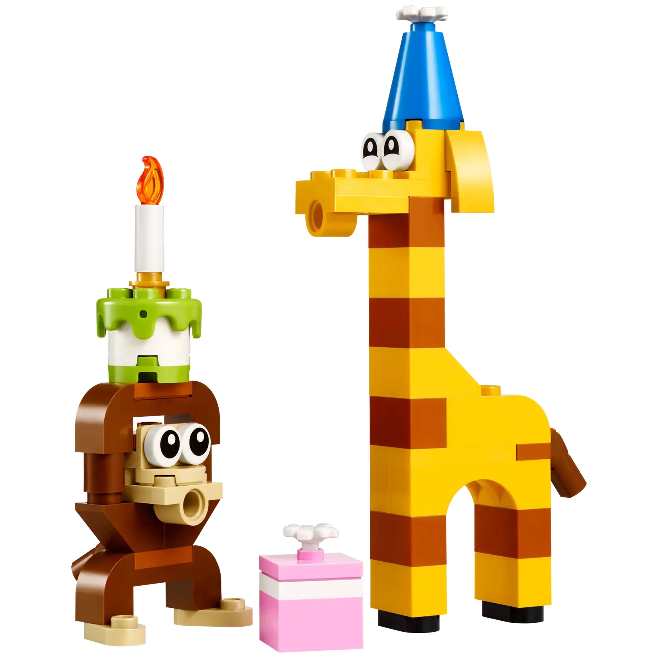 Adorable Lego monkey holding a birthday cake next to a cheerful yellow giraffe in a blue party hat, with a pink gift box nearby.