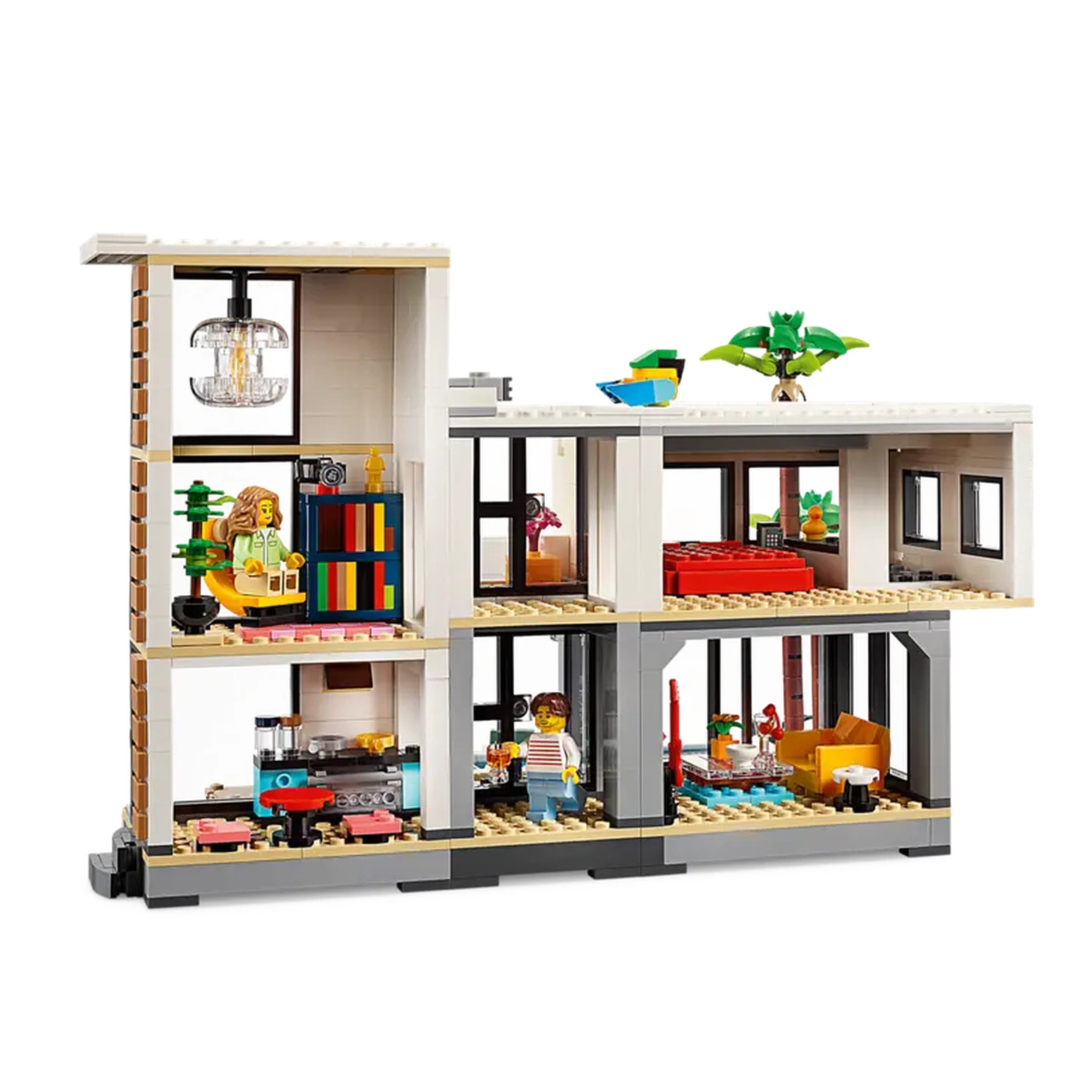 LEGO Creator Modern House construction set displaying a two-story building. Features include a living room, kitchen, bedroom, and a rooftop with a palm tree. Colorful furnishings and details create an inviting play environment for kids.