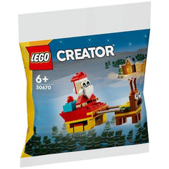 LEGO Creator Santa's Sleigh Ride construction set package featuring Santa and a reindeer pulling a red sleigh, with a snowy background and festive trees.