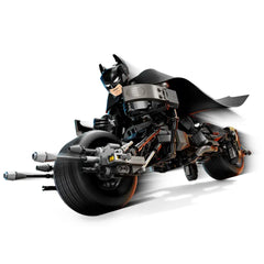 Batman in a black suit and cape, riding the Bat-Pod bike, featuring intricate details and two stud launchers, all in dynamic action pose.