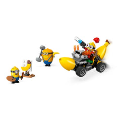 Four colorful Minion figures in a playful scene: one is painting a banana on a canvas, another lifts weights, while Mega Minion Dave drives a banana-shaped car with vibrant details.