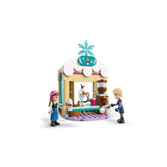 LEGO® Disney Frozen Anna's Sleigh Adventure set featuring Anna and Kristoff mini-doll figures at a hot chocolate stand, with Olaf serving drinks and a snowy decor above.
