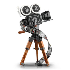 Vintage LEGO® Disney movie camera set with a film strip showcasing iconic Disney scenes, mounted on a brown tripod.