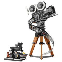 LEGO® Disney Walt Disney Tribute Camera set featuring a vintage movie camera on a tripod, surrounded by iconic minifigures and a film strip.