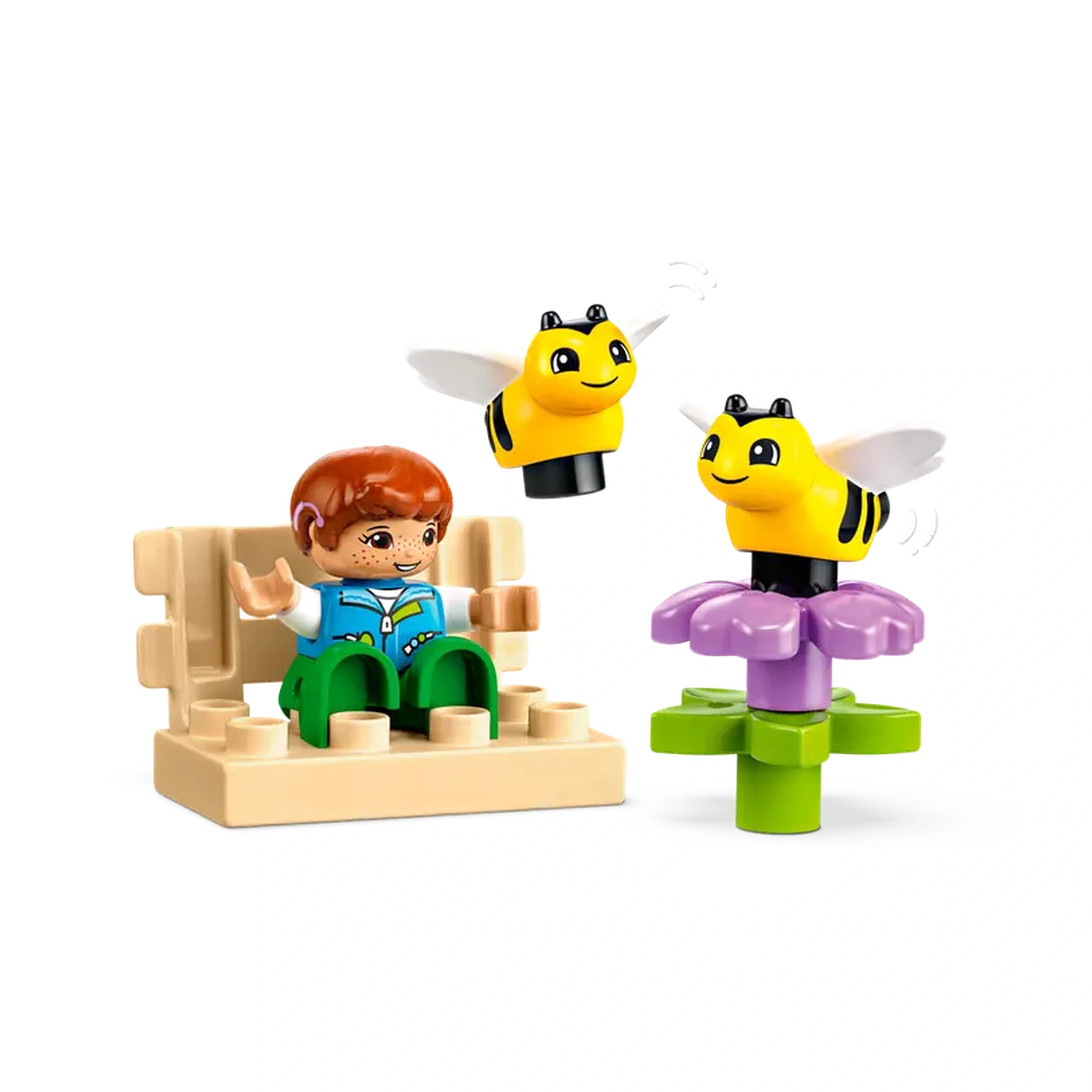 Child figure with red hair and blue vest sits on a beige bench, smiling at two yellow and black bee toys flying near a purple flower.