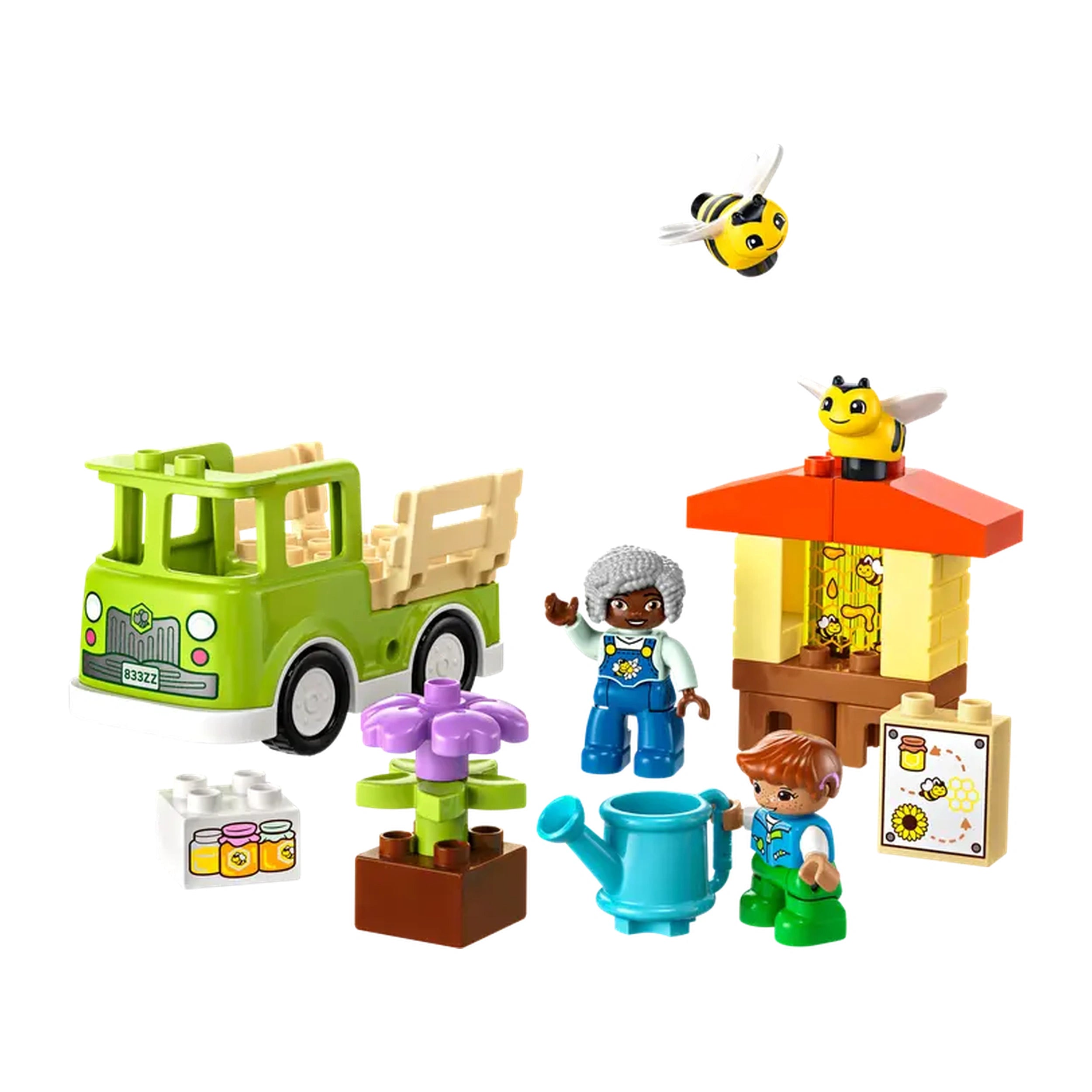 Colorful LEGO® DUPLO® Caring for Bees set featuring a green truck, flower, two children, a beehive, and playful bee figures.