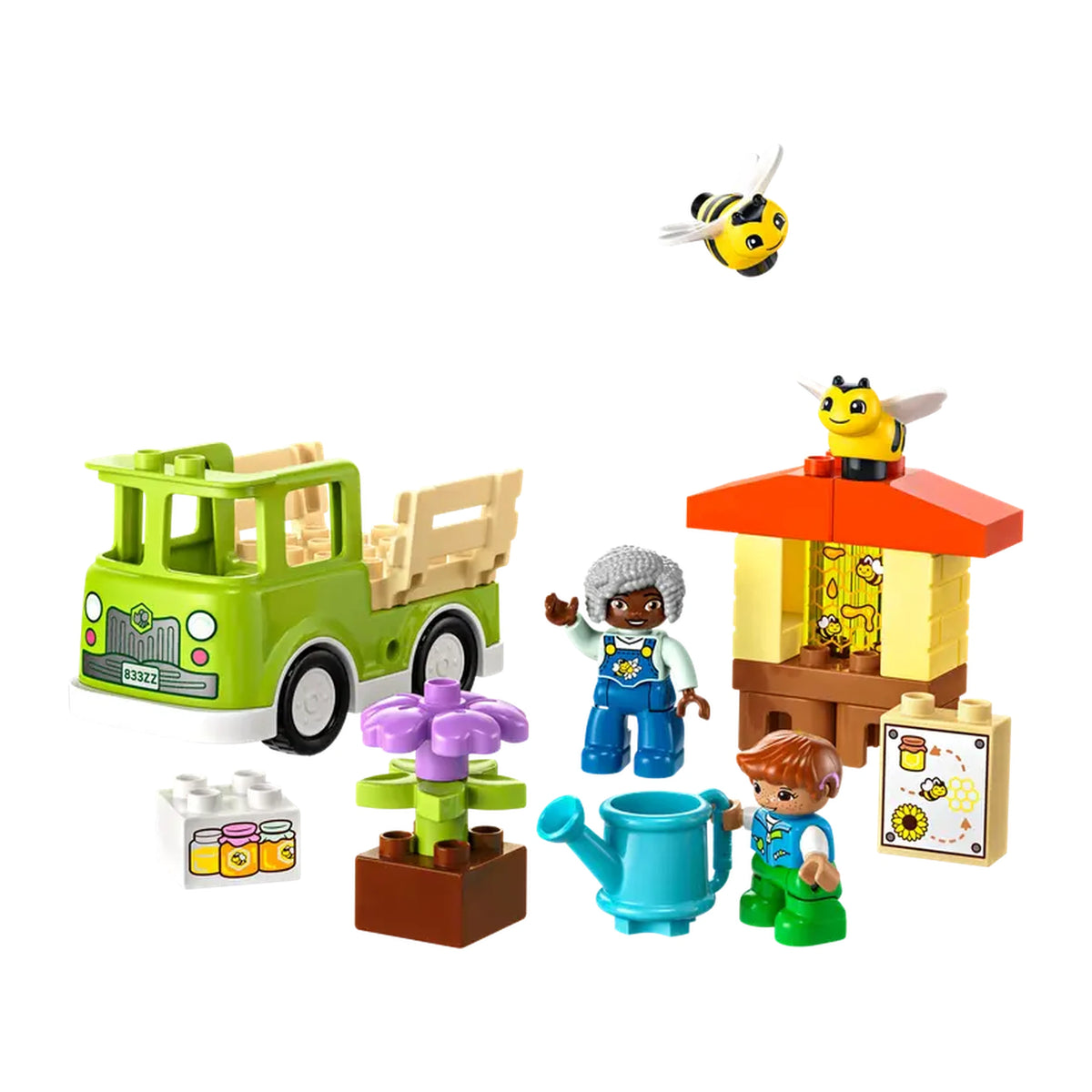 Colorful LEGO® DUPLO® Caring for Bees set featuring a green truck, flower, two children, a beehive, and playful bee figures.