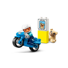 A smiling LEGO® DUPLO® police officer on a blue motorcycle performs a wheelie next to a yellow 'lost dog' sign and a cute brown dog.