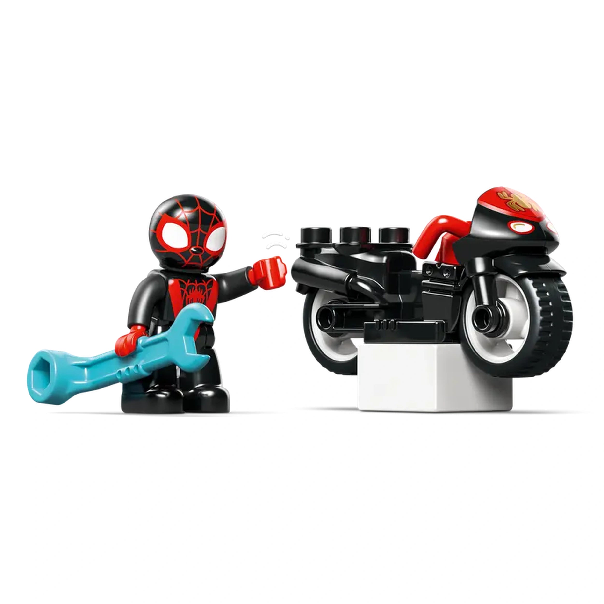 LEGO DUPLO Spin figure holding a blue wrench beside a black and red motorcycle on a white base, ready for action.