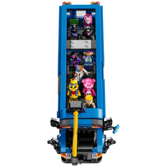 LEGO Fortnite Battle Bus construction set featuring colorful figures seated inside, including a character holding a dog, with a vibrant hot-air balloon above.