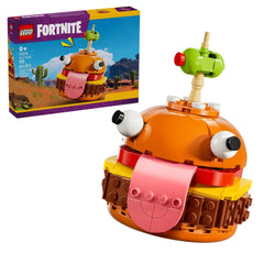 LEGO Fortnite Durrr Burger construction set, featuring a vibrant orange burger design with cartoonish eyes and a pink tongue, alongside its colorful box.