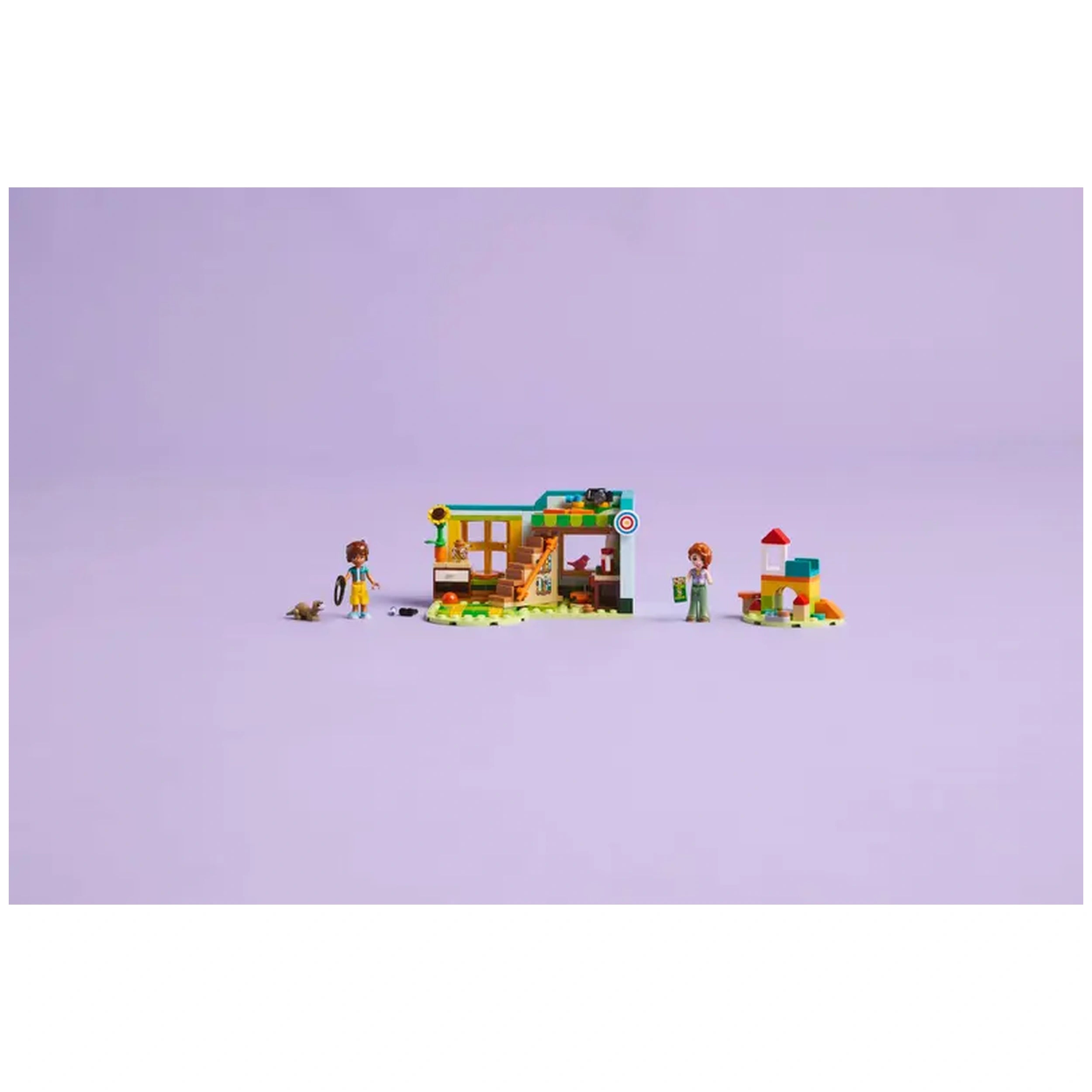 LEGO® Friends Autumn's Room set featuring a colorful buildable room, two mini-dolls, and animal figures, set against a purple backdrop.