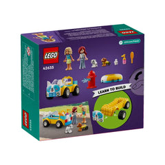 LEGO® Friends Dog-Grooming Car set (42635), featuring two mini-dolls, two dogs, and various grooming accessories, with vibrant colors and playful design.