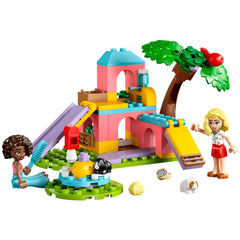 LEGO® Friends Guinea Pig Playground construction set featuring a colorful two-story play structure, a slide, and two minidolls engaging with adorable guinea pigs.