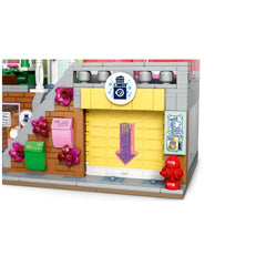 Colorful LEGO® Heartlake City laundromat featuring a yellow door, a washing machine sign, and decorative flowers on the walls.