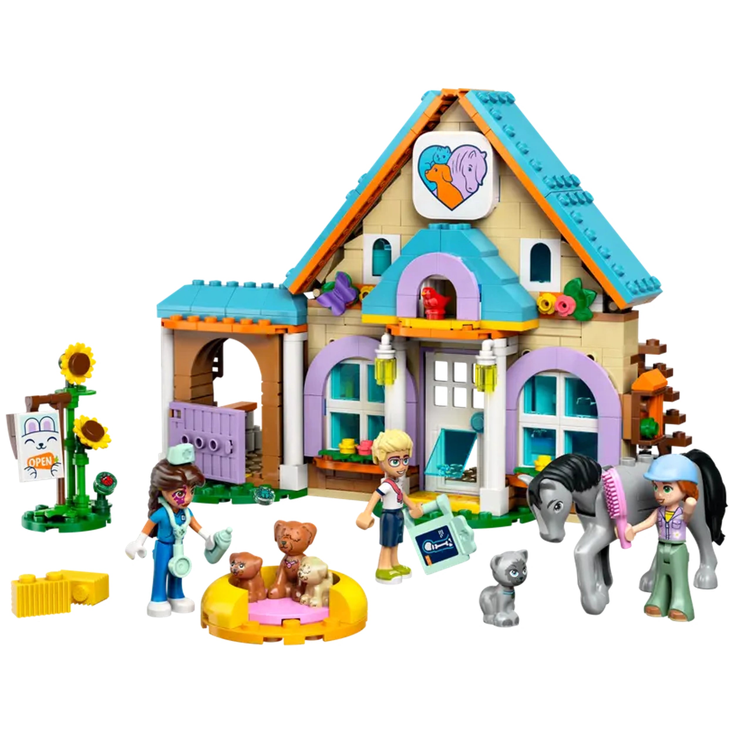 LEGO® Friends Horse and Pet Vet Clinic set featuring two minidolls, a horse, three puppies, and a kitten in front of a colorful building with veterinary tools and animal accessories.