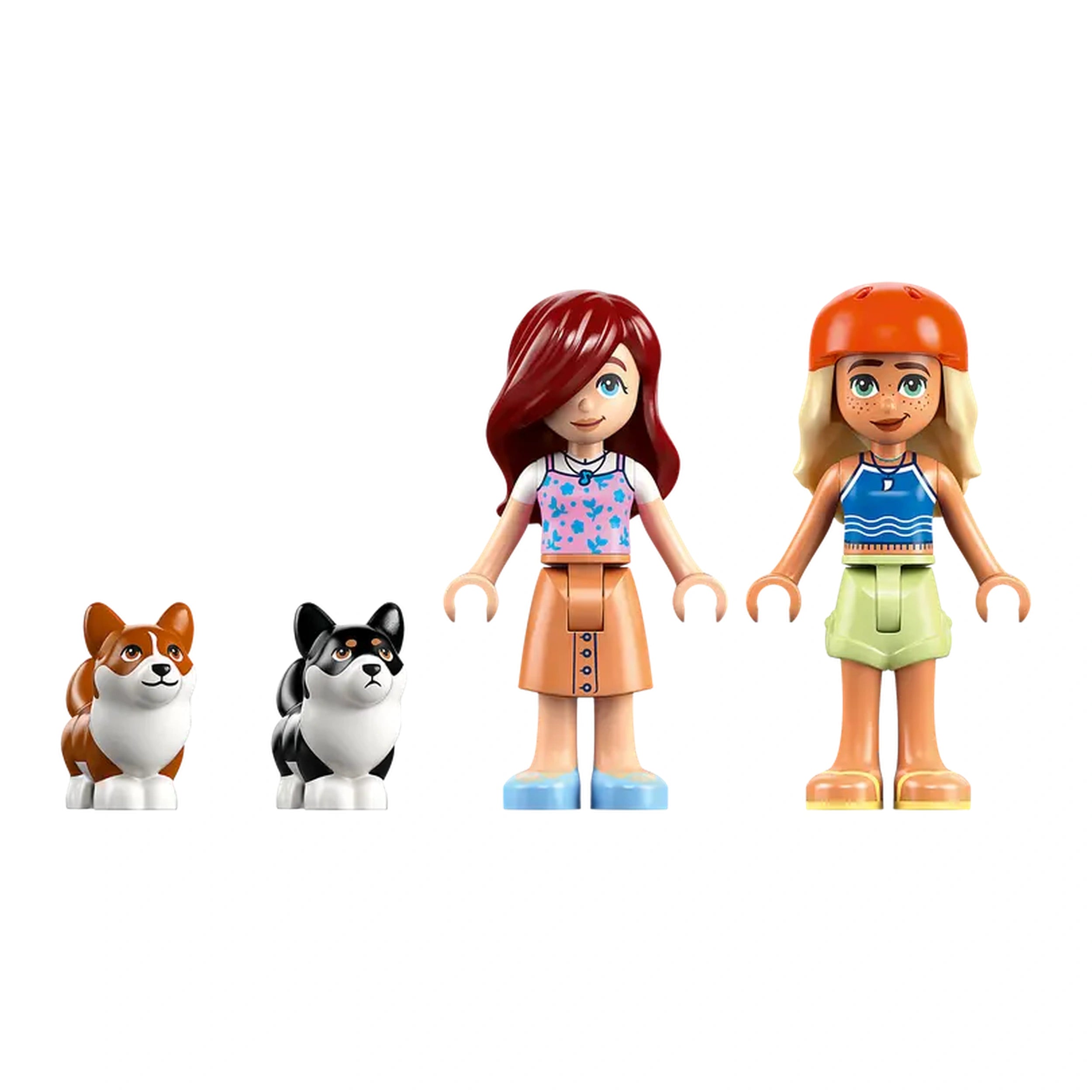 Two LEGO Friends minidolls, one with red hair in a pink top and the other with blonde hair in an orange helmet, stand next to two adorable corgi figures. The scene is vibrant, showcasing playful colors and a fun beach theme, perfect for imaginative play.