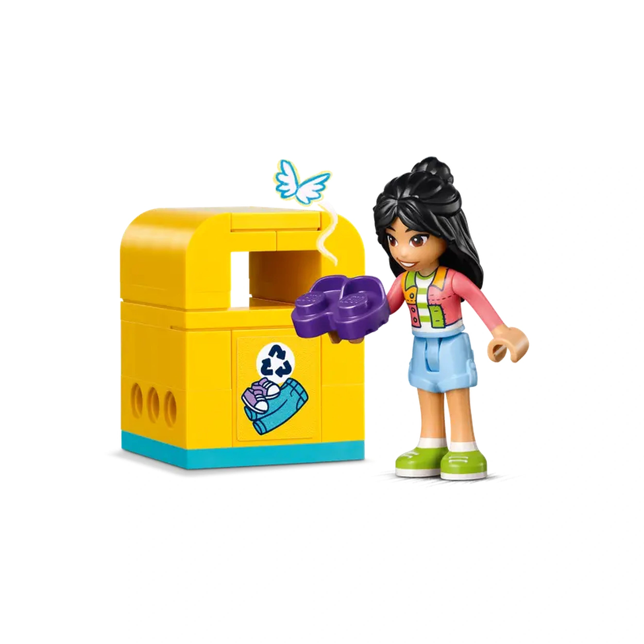 LEGO Friends character holding a purple item near a bright yellow recycling bin, promoting creativity and sustainability in fashion.