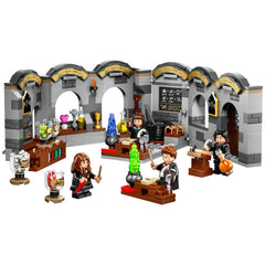LEGO Harry Potter Hogwarts Castle potions classroom set with four minifigures, colorful potion bottles, and a blackboard.