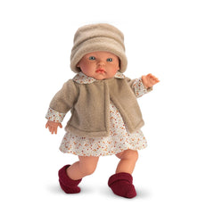 Alex doll from the Cherry Collection, in a beige fleece jacket, floral dress, and maroon booties, with light-colored eyes.